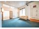 Spacious living room with large windows and worn couch at 354 King St St # B, Charleston, SC 29401
