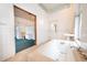 Bathroom with vintage bathtub and tiled walls at 354 King St St # B, Charleston, SC 29401