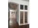 Long hallway with hardwood floors and access to other rooms at 354 King St St # B, Charleston, SC 29401