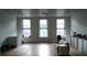 Spacious living area with hardwood floors and large windows at 354 King St St # B, Charleston, SC 29401