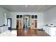 Open living space with hardwood floors and built-in cabinetry at 354 King St St # B, Charleston, SC 29401