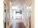 Bright hallway with hardwood floors and glass doors at 354 King St St # B, Charleston, SC 29401