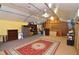 Versatile bonus room with high ceilings, a large rug, and ample storage at 717 Central Ave, Summerville, SC 29483