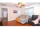 Living room with sectional sofa and hardwood floors at 717 Central Ave, Summerville, SC 29483