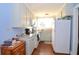 Cozy kitchen with white cabinets and appliances at 717 Central Ave, Summerville, SC 29483