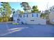 Two-story building with white trim and stairs at 717 Central Ave, Summerville, SC 29483