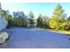 Large, paved parking area with green space at 717 Central Ave, Summerville, SC 29483