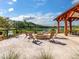 Relaxing fire pit area with seating overlooking a lake at 3881 Cunningham Ct, Mount Pleasant, SC 29466