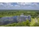 Stunning aerial view of a peaceful lake surrounded by lush greenery at 5000 Middleton Dr, Goose Creek, SC 29445