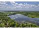 Aerial view of a lakefront community with lush green trees and a calm body of water at 5000 Middleton Dr, Goose Creek, SC 29445