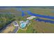 Aerial view showing community pool and clubhouse near marsh at 117 Silverbell Ln, Hollywood, SC 29470