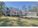 Stunning home exterior with landscaped lawn and driveway at 19 Bradley Pasture Way, Ravenel, SC 29470