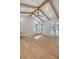 Main bedroom with hardwood floors, vaulted ceiling, and private access to balcony at 19 Bradley Pasture Way, Ravenel, SC 29470