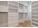 Spacious walk-in closet with built-in shelves and hanging rods at 19 Bradley Pasture Way, Ravenel, SC 29470
