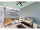 Relaxing screened porch with comfy seating and ceiling fan at 1458 Tangles Trl, Charleston, SC 29492