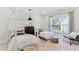 Bedroom with twin beds, light walls, and large window at 1458 Tangles Trl, Charleston, SC 29492