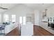 Open concept kitchen with island, stainless steel appliances, and white shaker cabinets at 1165 Oak Bluff Ave, Charleston, SC 29492