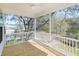 Relaxing screened porch with wooden deck and ceiling fan at 1165 Oak Bluff Ave, Charleston, SC 29492