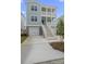 Two story light teal house with white accents and stairs at 1165 Oak Bluff Ave, Charleston, SC 29492