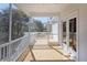 Screened porch with wooden deck and white railings at 1165 Oak Bluff Ave, Charleston, SC 29492