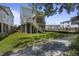 Elevated home with a large backyard and partial view of surrounding houses at 1466 Tangles Trl, Charleston, SC 29492