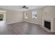Bright living room with hardwood floors, fireplace, and views to the foyer at 1466 Tangles Trl, Charleston, SC 29492