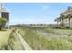 Waterfront view with marsh grasses and homes at 81 Sandbar Ln # 23, Folly Beach, SC 29439