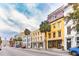 Historic Charleston street lined with colorful buildings and palm trees at 29 Broad St # C, Charleston, SC 29401