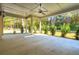 Spacious covered back porch with ceiling fan and wooded view at 3820 Gnarled Oaks Ln, Johns Island, SC 29455