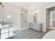 Modern bathroom with patterned tile floor, dual vanities, and a glass-enclosed shower at 3820 Gnarled Oaks Ln, Johns Island, SC 29455