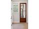 Entryway with a wooden door, window, and hardwood floors at 3820 Gnarled Oaks Ln, Johns Island, SC 29455