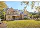 Charming two-story home with brick exterior, metal roof, and front yard at 3820 Gnarled Oaks Ln, Johns Island, SC 29455