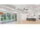 Open-concept kitchen and living area with sliding glass doors at 3820 Gnarled Oaks Ln, Johns Island, SC 29455