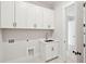 Laundry room with white cabinets, sink, and tile floor at 3820 Gnarled Oaks Ln, Johns Island, SC 29455