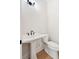Powder room featuring a pedestal sink and modern black fixtures at 3820 Gnarled Oaks Ln, Johns Island, SC 29455