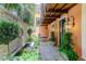 Private courtyard with water feature and brick wall at 29 Broad St # B, Charleston, SC 29401