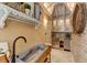 Butler's pantry with farmhouse sink, custom cabinetry, and wine cooler at 29 Broad St # B, Charleston, SC 29401