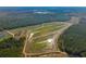 Aerial view showing expansive property with ponds and lush forest at 6500 Parkers Ferry Rd, Adams Run, SC 29426