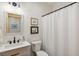 Clean bathroom with a white vanity, toilet, and shower at 6500 Parkers Ferry Rd, Adams Run, SC 29426