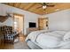 Main bedroom with a king-size bed and en-suite bathroom access at 6500 Parkers Ferry Rd, Adams Run, SC 29426