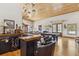 Rustic bar with leather barstools, perfect for entertaining at 6500 Parkers Ferry Rd, Adams Run, SC 29426