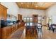 Open kitchen features a center island, wood cabinets, and views to backyard at 6500 Parkers Ferry Rd, Adams Run, SC 29426