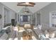 Sunlit living room featuring vaulted ceilings, comfy sofas, and a fireplace at 2317 Sunfish Cir, Charleston, SC 29412