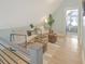 Relaxing loft area with two armchairs, ottomans, and natural light at 2317 Sunfish Cir, Charleston, SC 29412