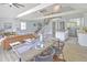 Open dining area with farmhouse table and modern chairs at 2317 Sunfish Cir, Charleston, SC 29412