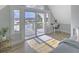 Bright bedroom with water views and sliding glass doors to deck at 2317 Sunfish Cir, Charleston, SC 29412