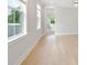 Spacious bedroom with hardwood floors and access to another room at 1153 Oak Bluff Ave, Charleston, SC 29492