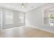 Bright bedroom featuring hardwood floors and multiple windows at 1153 Oak Bluff Ave, Charleston, SC 29492