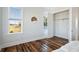 Bright bedroom with hardwood floors, white walls, and a walk-in closet at 2545 Anchor Watch Dr, Wadmalaw Island, SC 29487