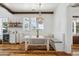 Charming breakfast nook with built-in bench seating and rustic table at 2545 Anchor Watch Dr, Wadmalaw Island, SC 29487